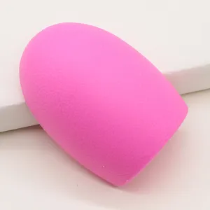 Silicone makeup brush cleaner egg tool, vibrant pink washing scrubber for daily cosmetic tool care.