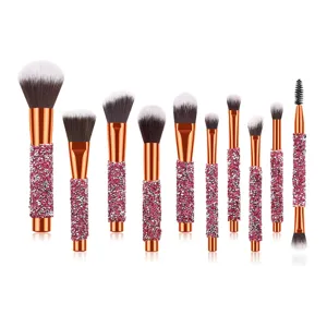 Detailed view of the 10-piece rhinestone makeup brush set featuring sparkling pink crystal handles.