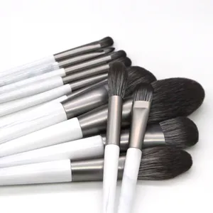 12pcs tapered makeup brush set with white marble handle and soft bristles for detailed face beauty.