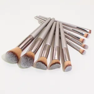Champagne makeup brush set detail view showing soft bristles and handles for flawless beauty application.