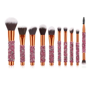 10-piece rhinestone makeup brush set with sparkly pink crystal handles and rose gold ferrules.