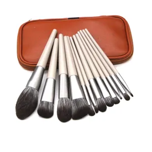 Detailed view of a versatile 12-piece makeup brush set with elegant handles and storage pouch.