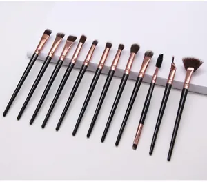 Close-up display of twelve piece eye makeup brush set featuring soft nylon bristles and holders.