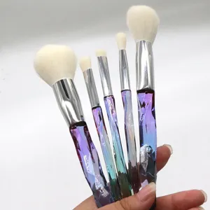 5-piece makeup brush set with crystal diamond gradient handles, soft white bristles, detail view.