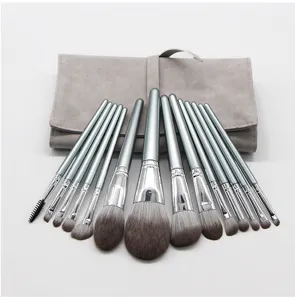 Professional 14-piece makeup brush set with soft synthetic bristles and grey storage bag.
