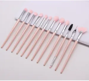 Professional 13-piece pink makeup brush set with soft nylon hair and durable handles for eyes.