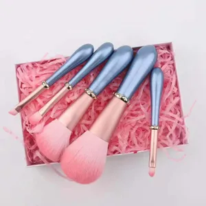 5-piece makeup brush set with crystal accents, soft pink bristles and blue handles for flawless daily beauty.