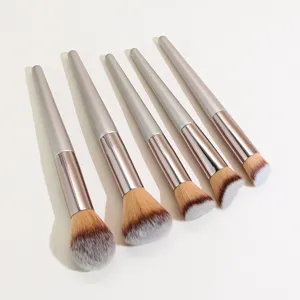 Detailed view of makeup brush set with silver handles and soft gradient bristles for smooth blending.