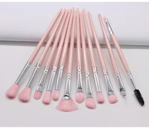 12-piece pink makeup brush set with soft nylon bristles and portable plastic handles.