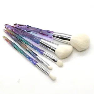 5-piece crystal diamond makeup brush set with gradient transparent handle and soft white bristles.