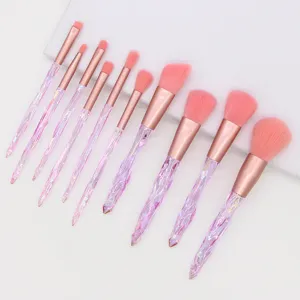 10-piece diamond crystal makeup brush set featuring pink bristles and rose gold handles.