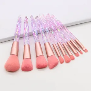 10pcs crystal diamond makeup brush set with pink bristles and glowing glass handle for face.
