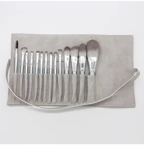 Professional 14-piece makeup brush set with grey roll bag, soft bristles for flawless blending.