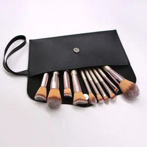 Closeup of 10-piece makeup brush set with black storage pouch, soft bristles and champagne handles.