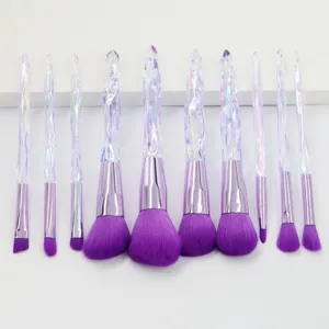 Detail view of 10-piece crystal handle makeup brush set with vibrant purple bristles.