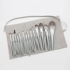 14-piece professional makeup brush set with soft bristles and portable gray roll pouch.