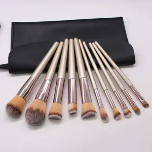 10-piece champagne makeup brush set with soft bristles and black storage pouch for beauty tools.