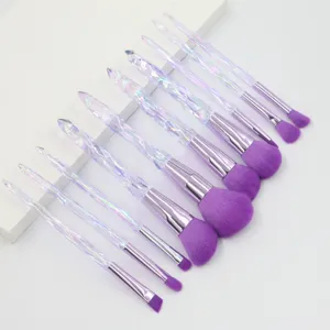 Detailed view of crystal diamond handle makeup brush set with soft purple bristles.