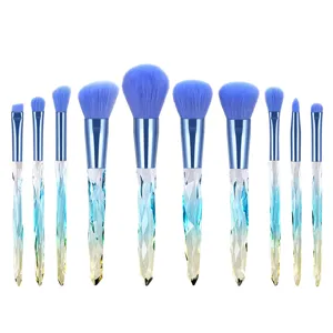 Professional 10-piece makeup brush set with vibrant blue bristles and crystal diamond handles.
