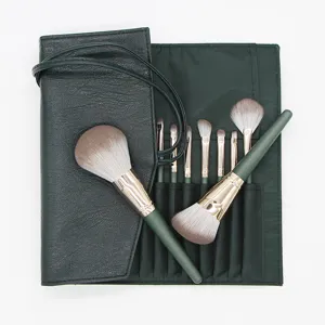 Detail view of the 14-piece makeup brush set in dark green roll pouch with soft bristles.