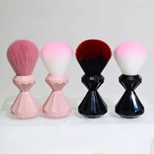 Soft large makeup brush and nail dust brush with diamond faceted handle for beauty tools.