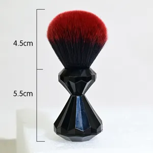 High quality makeup brush with diamond faceted black handle and soft red gradient hair.