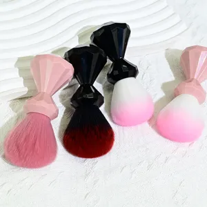 Detail shot of diamond handle makeup brushes with soft gradient bristles for blush and nail art.