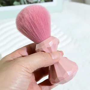 Pink diamond handle makeup brush, soft dense bristles for blush and powder application.