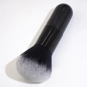Professional black kabuki makeup brush for loose powder and foundation application.