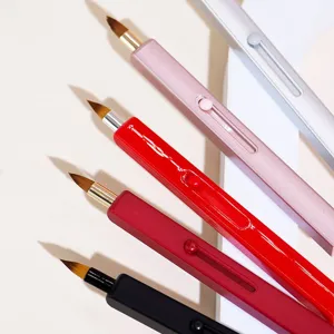 Portable retractable lip brush makeup tool with sleek push-pull design for precise application.