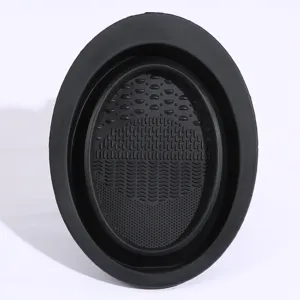 Silicone makeup brush cleaner bowl detail, collapsible design with textured washing surface.