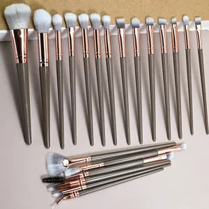 20-piece brown makeup brush set with soft bristles for face, eyes, and eyeliner. Professional cosmetic tool.
