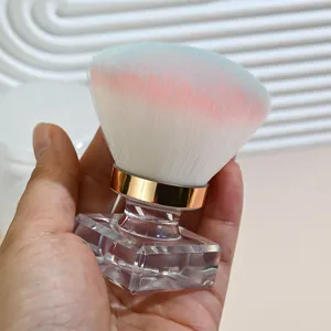 Detailed view of the soft gradient nail dust brush with clear square crystal handle.