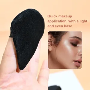 Black triangle velvet powder puff for smooth makeup setting and face contouring detail.