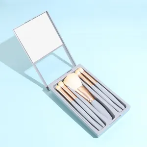 Detailed view of 5-piece portable makeup brush set with integrated mirror case, grey.