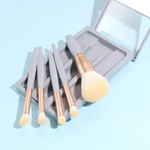 Detail shot of makeup brush set in a grey case with mirror, soft bristles for smooth blending.