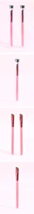 Detailed view of the pink angled makeup brush featuring soft synthetic bristles and protective tube.