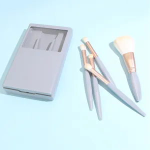 Detailed view of portable 5-piece makeup brush set with grey case and soft bristles.