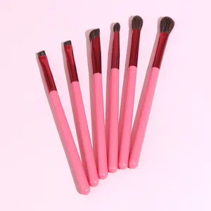 Set of 6 pink handle eye makeup brushes for professional eyebrow and eyeshadow application.