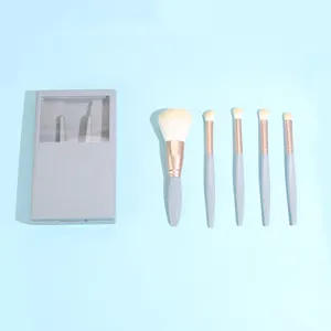 Portable 5-piece makeup brush set with mirror travel beauty tool kit for daily flawless makeup.