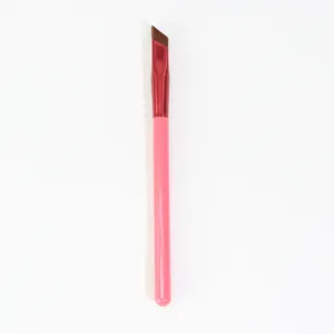 Professional angled eyebrow brush with pink handle and soft bristles for precise makeup application