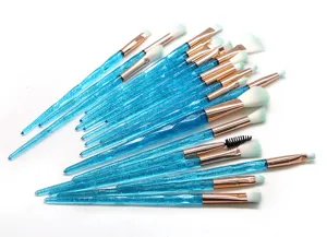 Detailed shot of 20pcs blue glitter makeup brush set, crystal handle and soft dual color bristles.