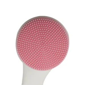 Brosse nettoyante visage en silicone, outil double face rose avec poils doux et fins.