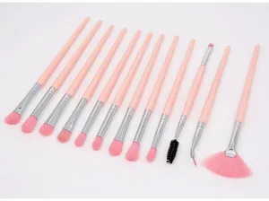 Professional 12-piece pink makeup brush set with soft synthetic bristles for flawless blending.