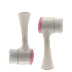 Brosse nettoyante pour le visage double face avec poils doux et silicone pour le soin.
