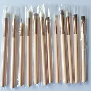 12-piece eye makeup brush set with wooden handles and golden ferrule for blending.