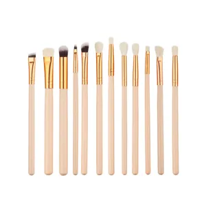 Professional 12-piece eye makeup brush set with wooden handles for versatile eyeshadow application.