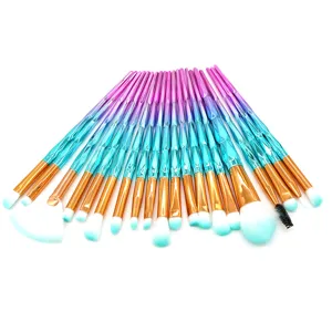 Detailed view of 20-piece makeup brush set with gradient diamond-cut handles and soft teal tips.