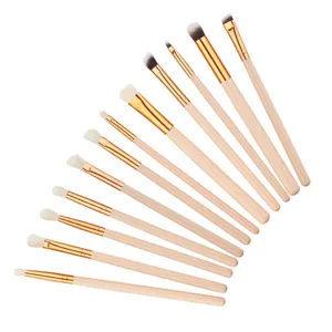 12-piece eye makeup brush set with wooden handles and golden ferrules for precise eye shadow.