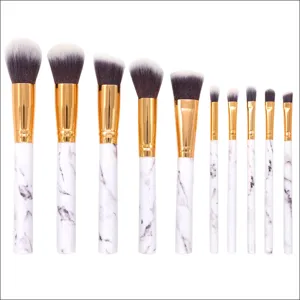 10-piece marble makeup brush set with soft synthetic bristles and gold handles for face.